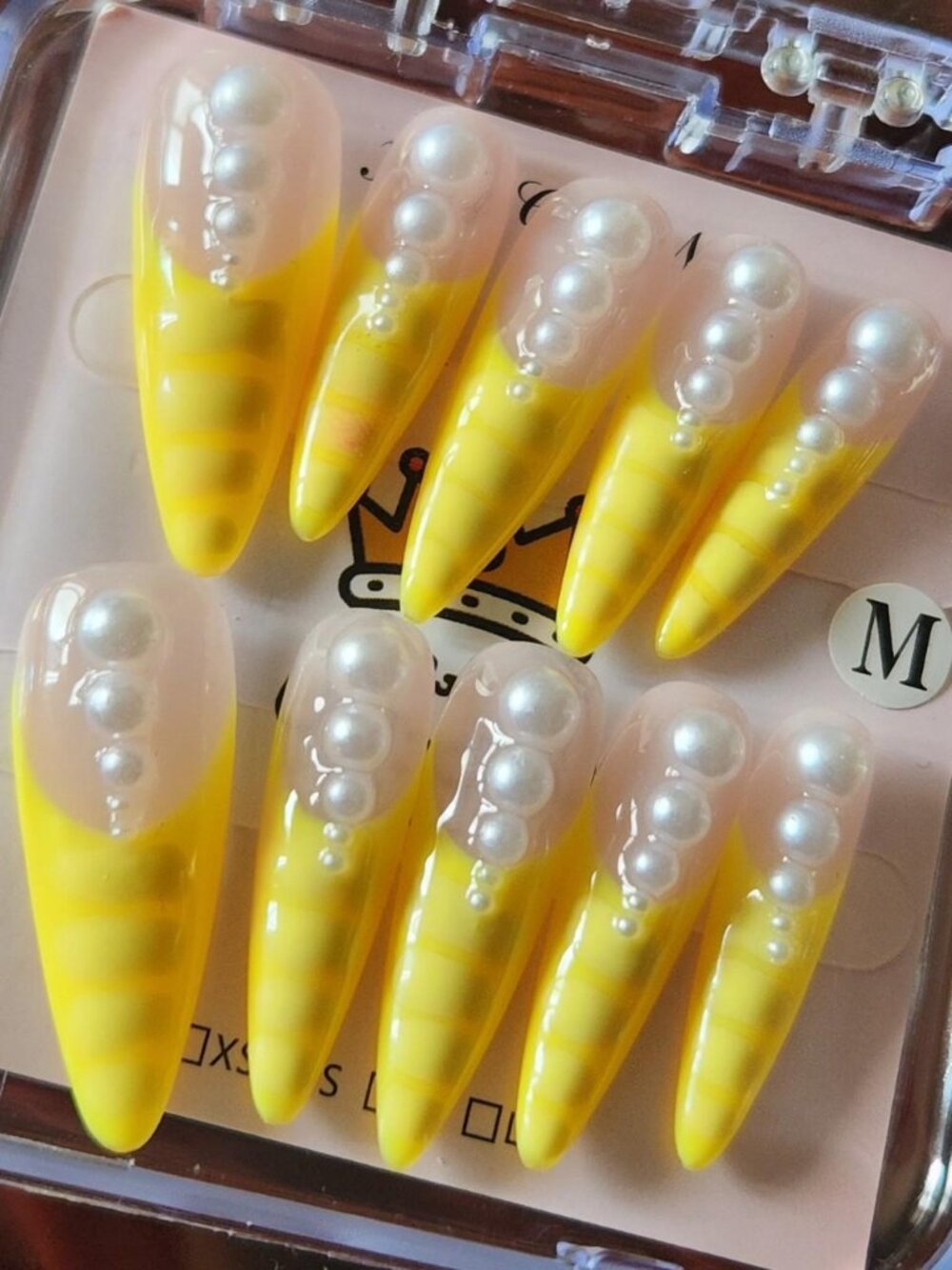 3.0 Yellow French tip stiletto press-on nails with pearls. Size M.